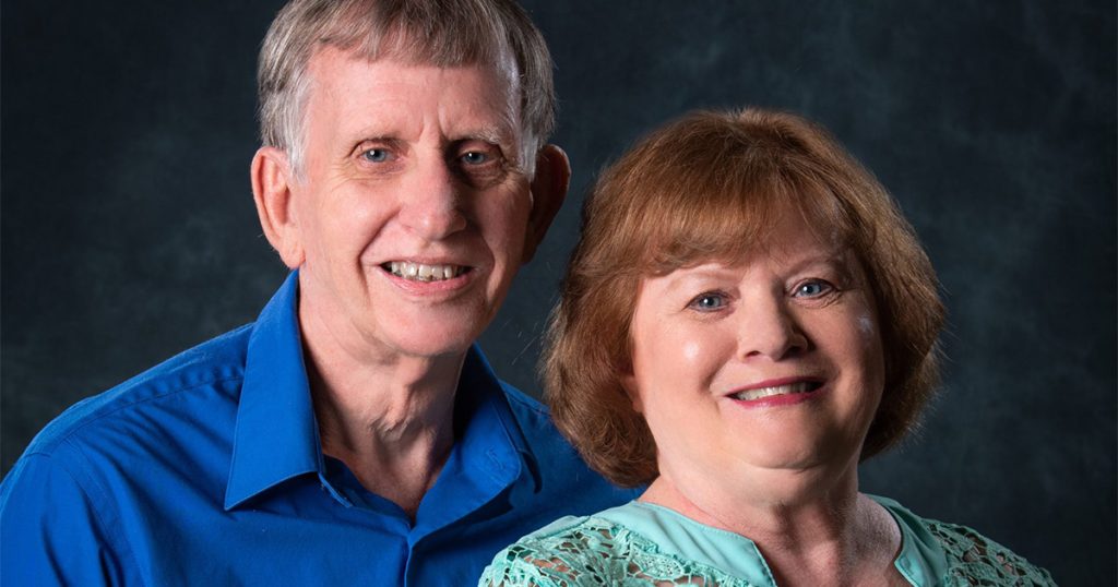 Two people smiling