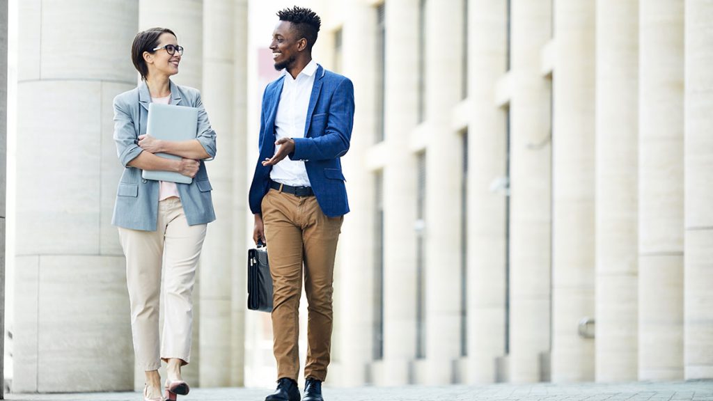 Two professionals walking and talking