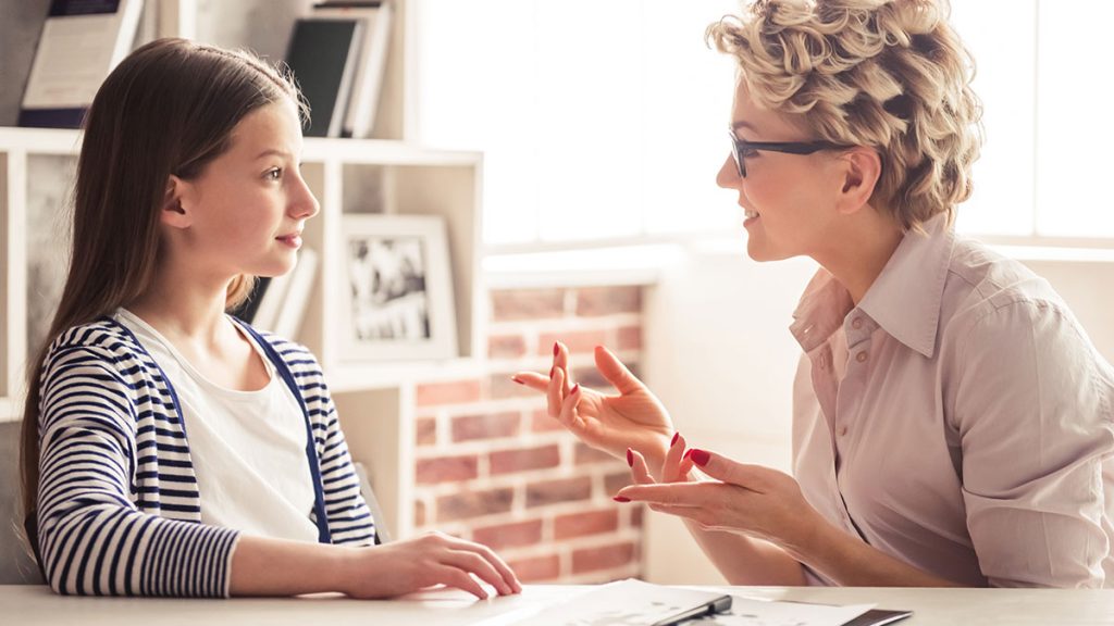 Woman talking to a child