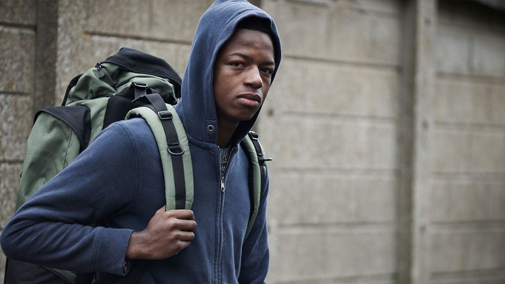 Teen looking sad while walking