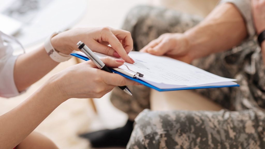 Close up of hands on a clipboard