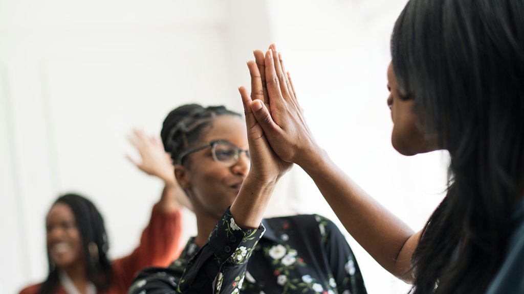 Group of people high-fiving