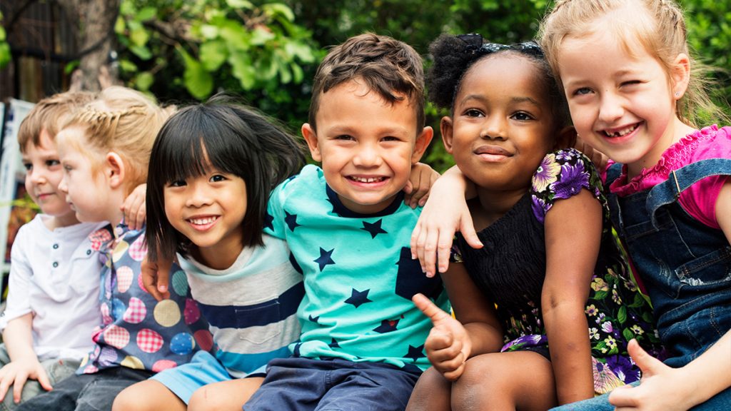 Group of children arm-in-arm