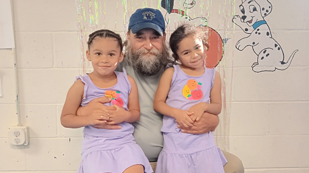 Chris Rhodus and his grandaughters, Zoe and Zamiya