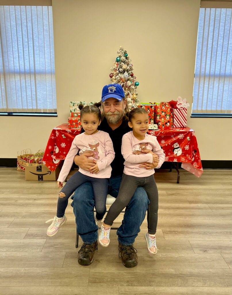 Chris Rhodus and his granddaughters, Zoe and Zamiya