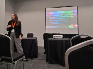Dr. Carly Kimiecik presenting her research at the ASWIS Annual Symposium