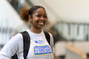 Student Jordin Williams smiling in SWAA Alumni-Student Mentoring Program Sweatshirt
