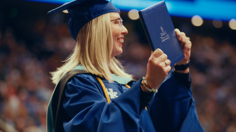 New graduate during Commencement Proceedings