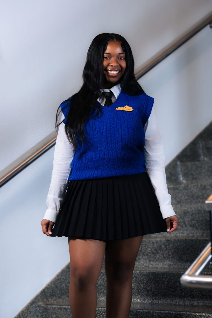 Jordin Williams standing on steps in UK Blue attire