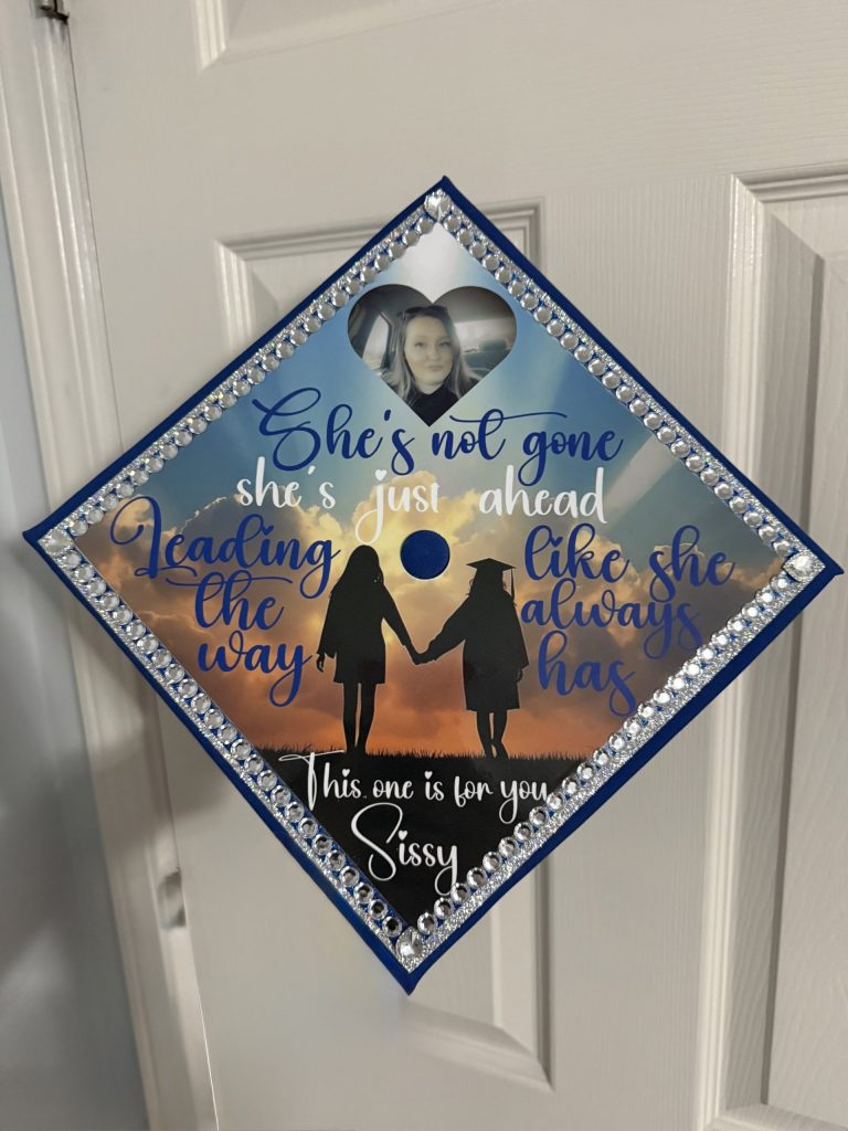 Tiffany Malicote's graduation cap honoring her older sister