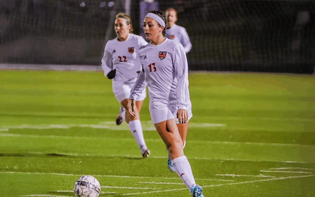 Anne Stauffer dribbling a ball during a game