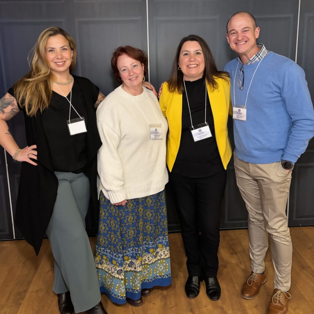 Priscila Llamosa, Michelle Keller, Kristel Scoresby and Blake Conley stand together during at the International Family Therapy Association Annual Conference in Norway.