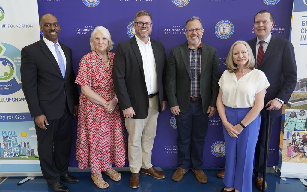 Aaron Brown at the KYOAAC press event with KYOAAC members, UK faculty and the KY Attorney General