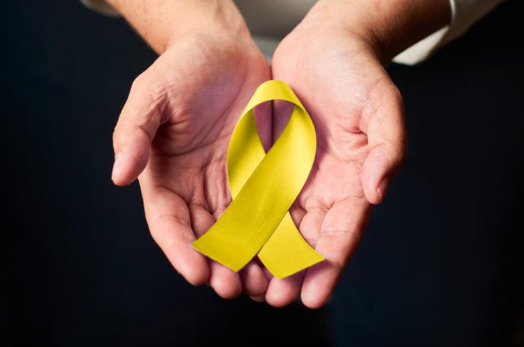 World Suicide Prevention Day concept with awareness yellow ribbon