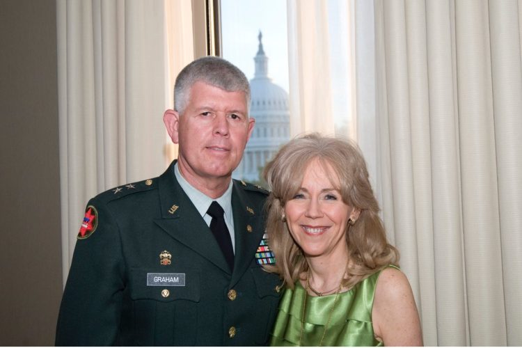 Mark and Carol Graham posing together at the Capital in Washington, DC