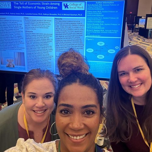 Dr. Laneshia Conner, Dr. Sheila Barnhart and Dr. Aubrey Jones in front of their presentation: The Toll of Economic Strain Among Single Mothers of Young Children.